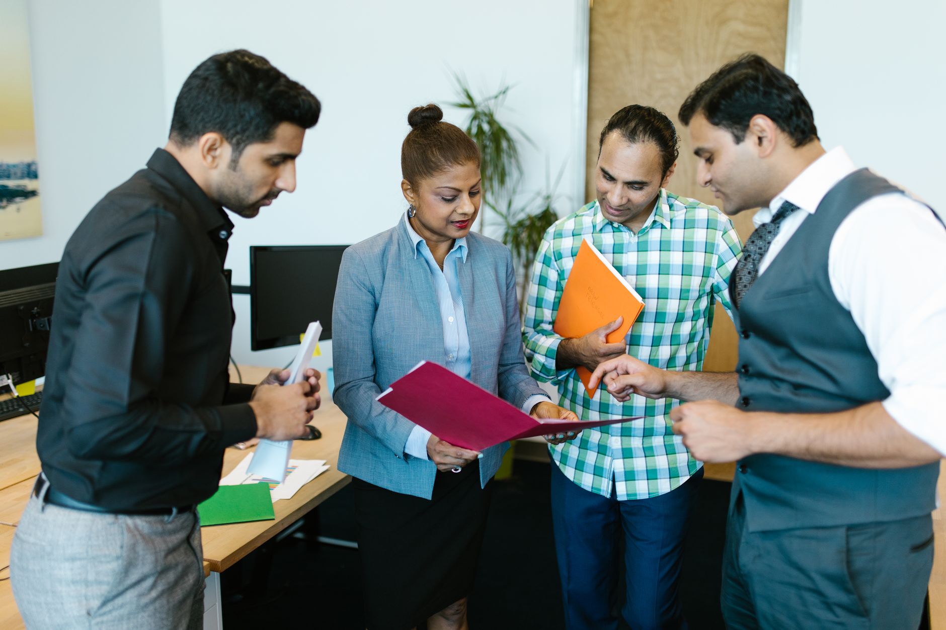 Indian business team discussion for Bulk Vouchers article