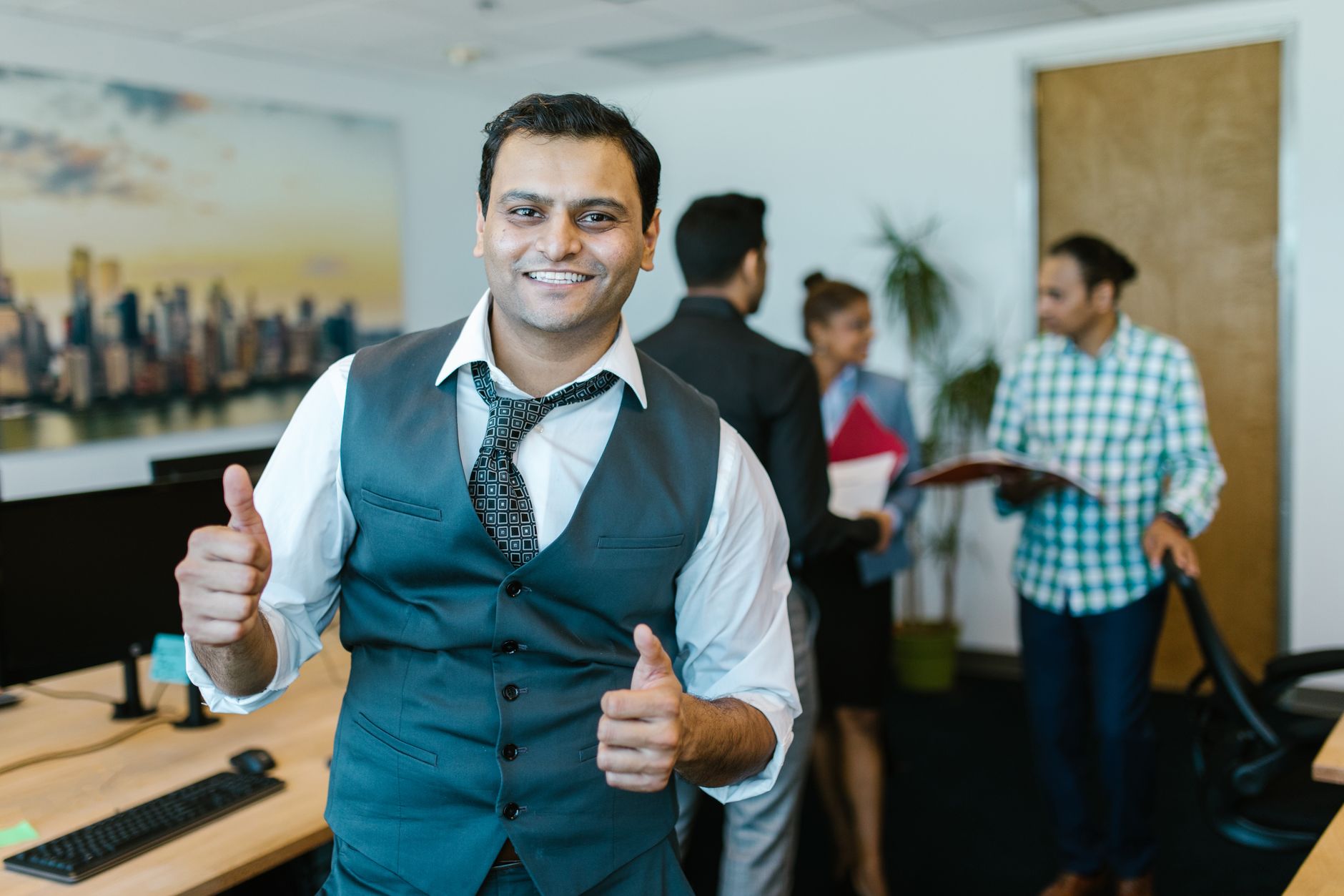 Indian business team discussion for Employee Recognition article
