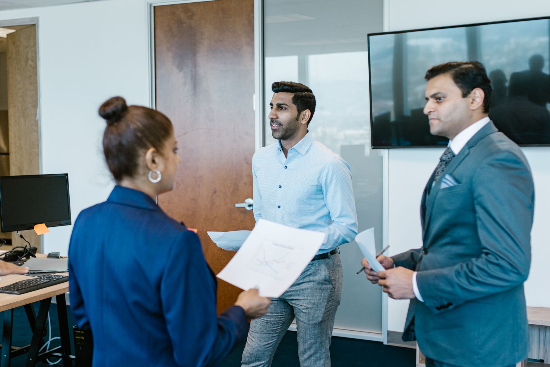 Indian business team discussion for Employee Recognition article