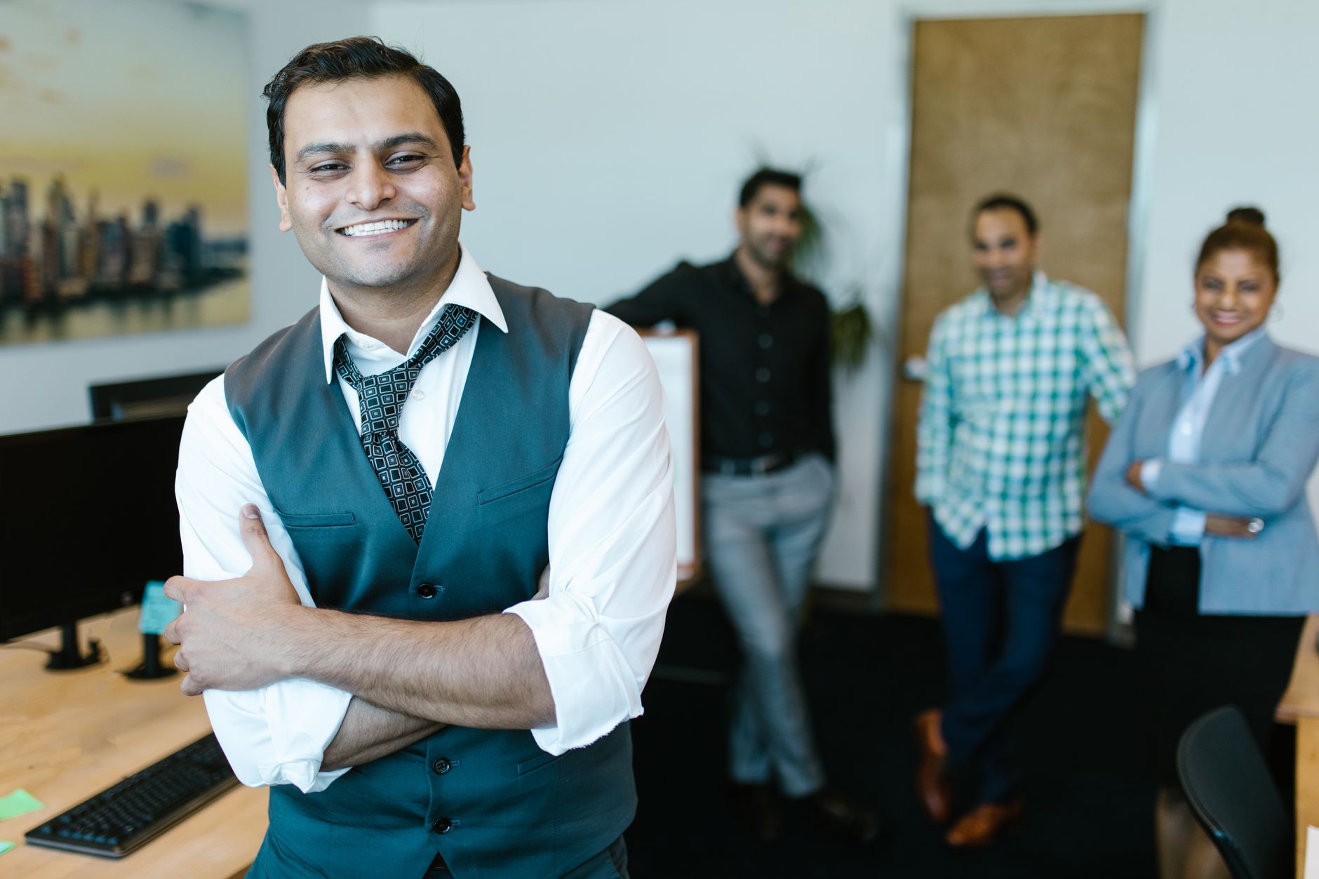Indian business team discussion for Employee Recognition article